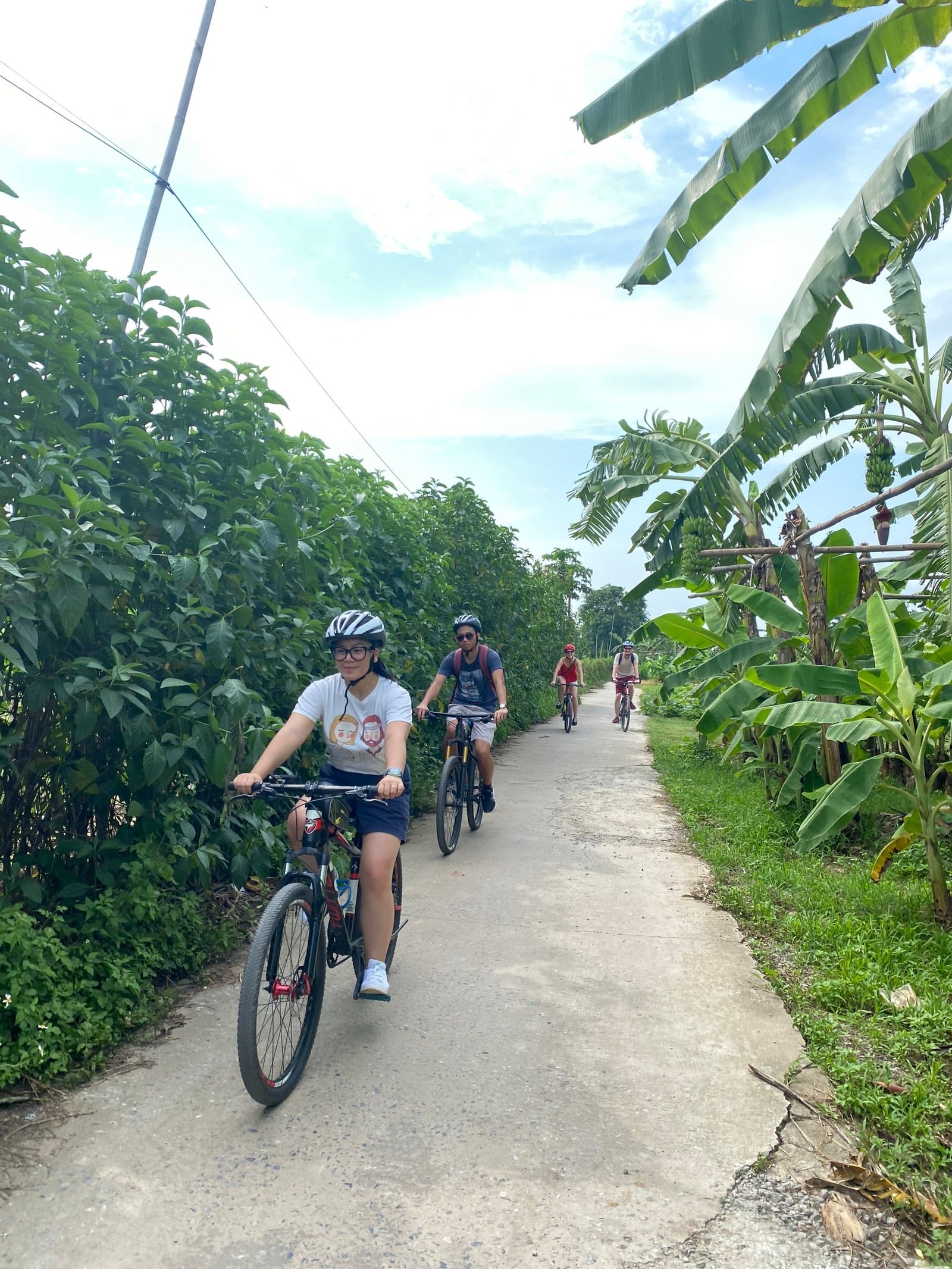 Cyclist riding through scenic Vietnam countryside and mountain roads