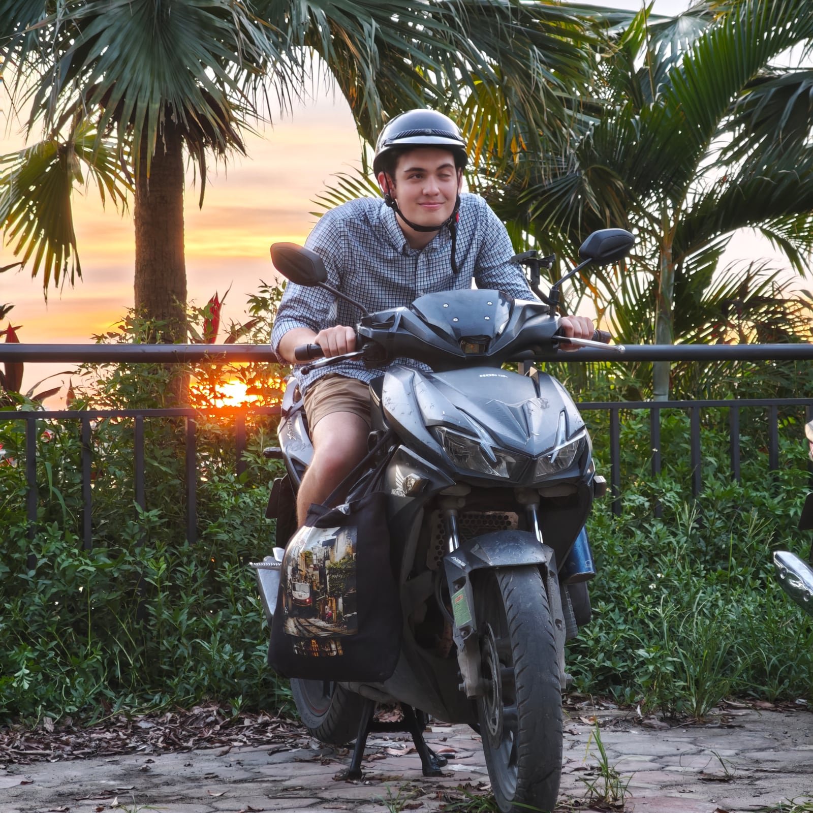 Motorbike on scenic mountain road through lush Vietnamese jungle