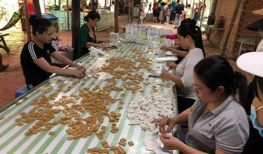 Discover how traditional, handcrafted coconut candy is made at a local workshop in the Mekong Delta