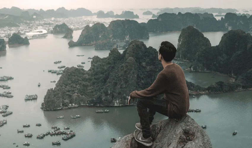 Traveler overlooking Ha Long Bay during a classic highlights tour in Vietnam